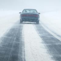 Car on snow covered road